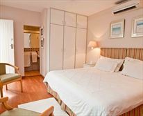 Studio self catering unit - bedroom looking through to the en-suite bathroom - Manaar House B & B